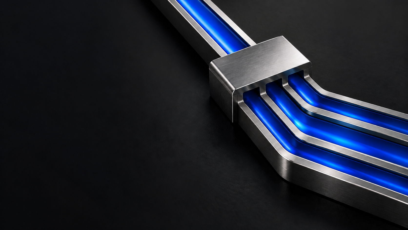 Conceptual illustration of a metallic junction with three continuous blue routing channels, not a technical workflow diagram.